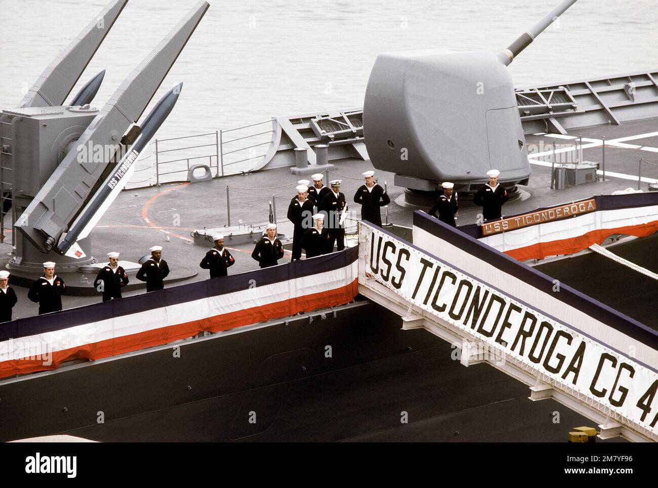 Crew members man the rail aboard the first Aegis guided missile cruiser