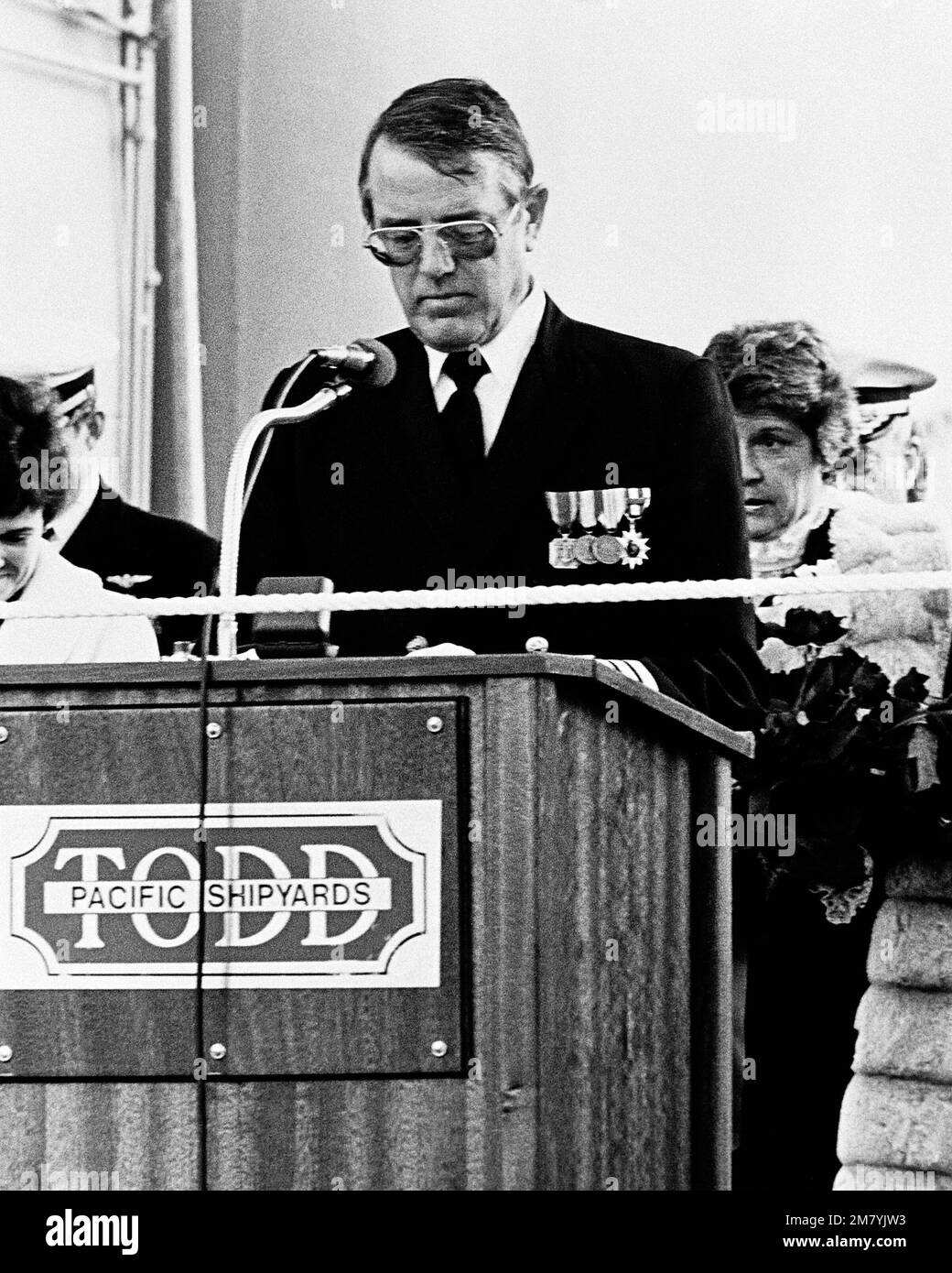 Captain Joseph A. Brennan, chaplain, gives the invocation during the