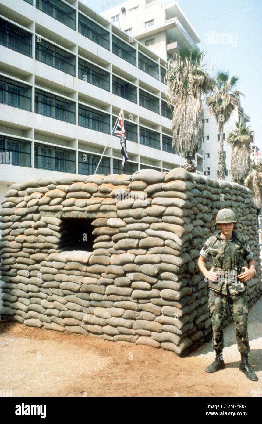 A Marine stands guard outside the British Embassy. He is participating