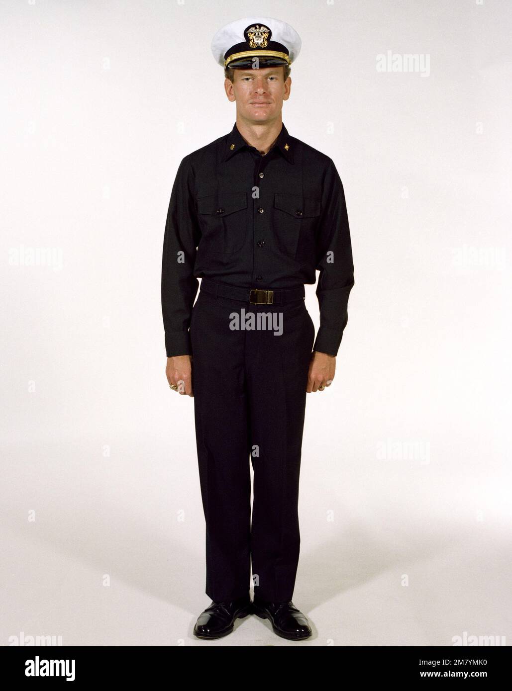 Uniform: Winter working blue, male Navy officers. Country: Unknown