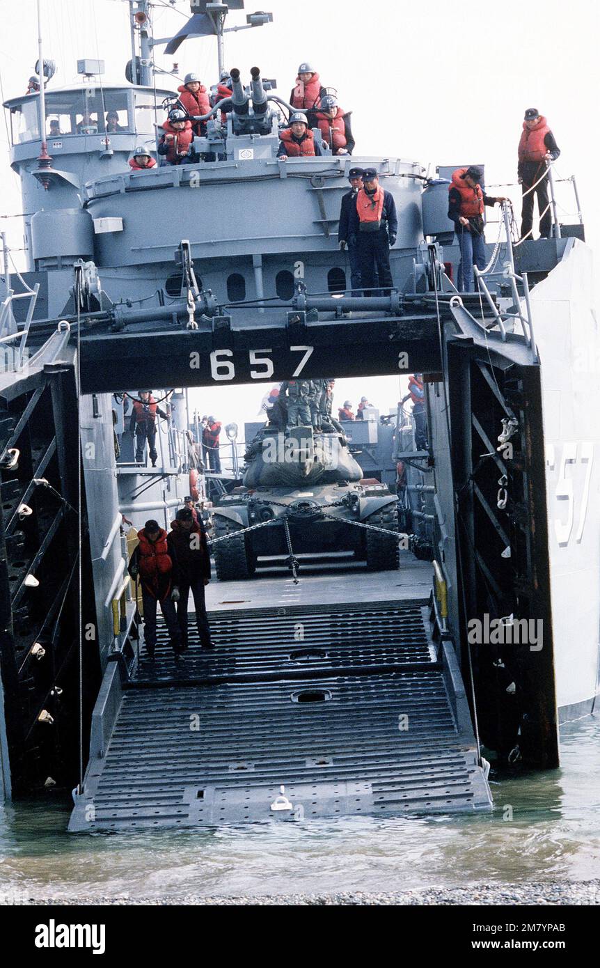 A Republic of Korea navy tank landing ship prepares to offload a tank during rehearsal day activities for Exercise Team Spirit '83. Subject Operation/Series: TEAM SPIRIT '83 Base: Toc Sac Re Country: South Korea Stock Photo