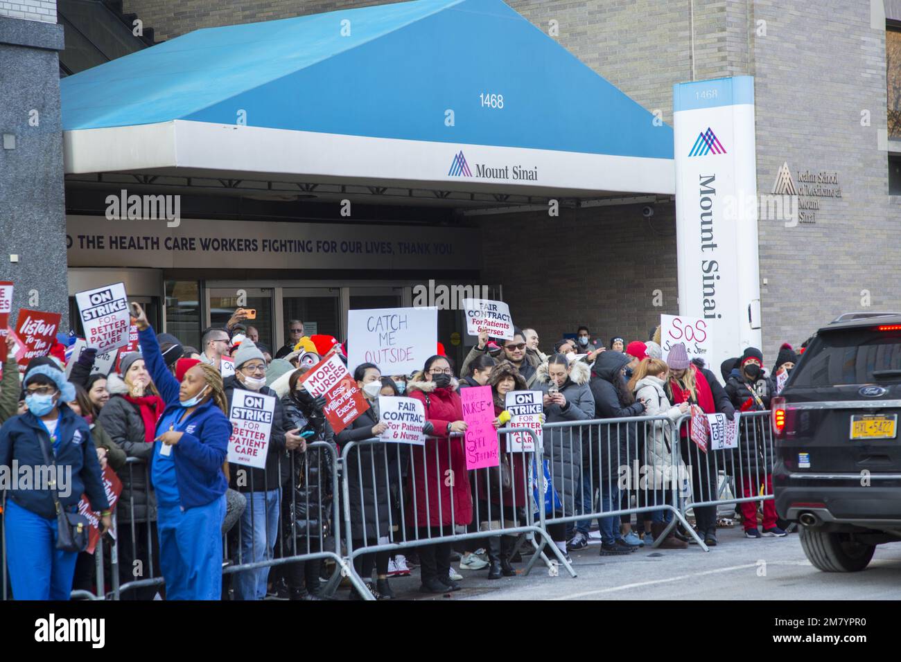 More than 7,000 nurses at Mount Sinai Medical Center and Montefiore Medical Center are seeking better wages and working conditions.   Hundreds of striking nurses and their supporters lined both sides of Madison Avenue in front of Mount Sinai Hospital on Monday January 9, 2023 waving signs, blowing horns and calling for a labor contract that will require more nurses at the bedside for patients. Stock Photo