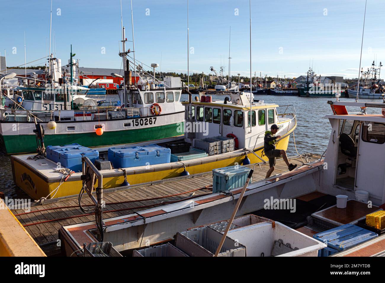 BOATS AT THE QUAY OF THE FISHING PORT, CARAQUET, NEW BRUNSWICK, CANADA, NORTH AMERICA Stock Photo