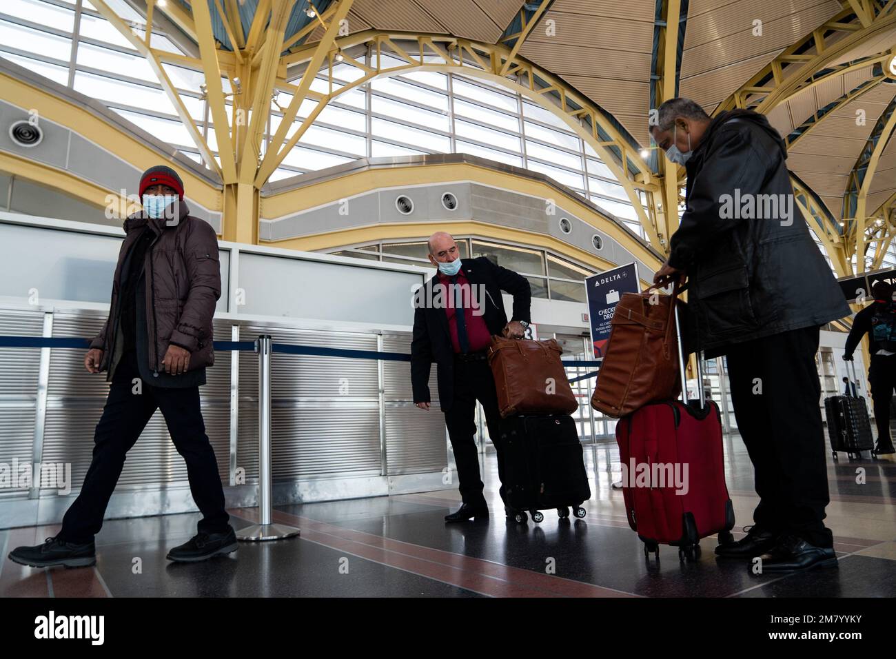 Washington, USA. 11th Jan, 2023. Passengers are seen at Ronald Reagan Washington National Airport in Arlington, Virginia, the United States, Jan. 11, 2023. The Federal Aviation Administration (FAA) said Wednesday morning it is lifting the ground stop as normal air traffic operations are resuming gradually across the United States following a system outage. The FAA, which regulates all aspects of civil aviation in the country, wrote in its latest update that it continues to look into the cause of the initial problem. Credit: Liu Jie/Xinhua/Alamy Live News Stock Photo