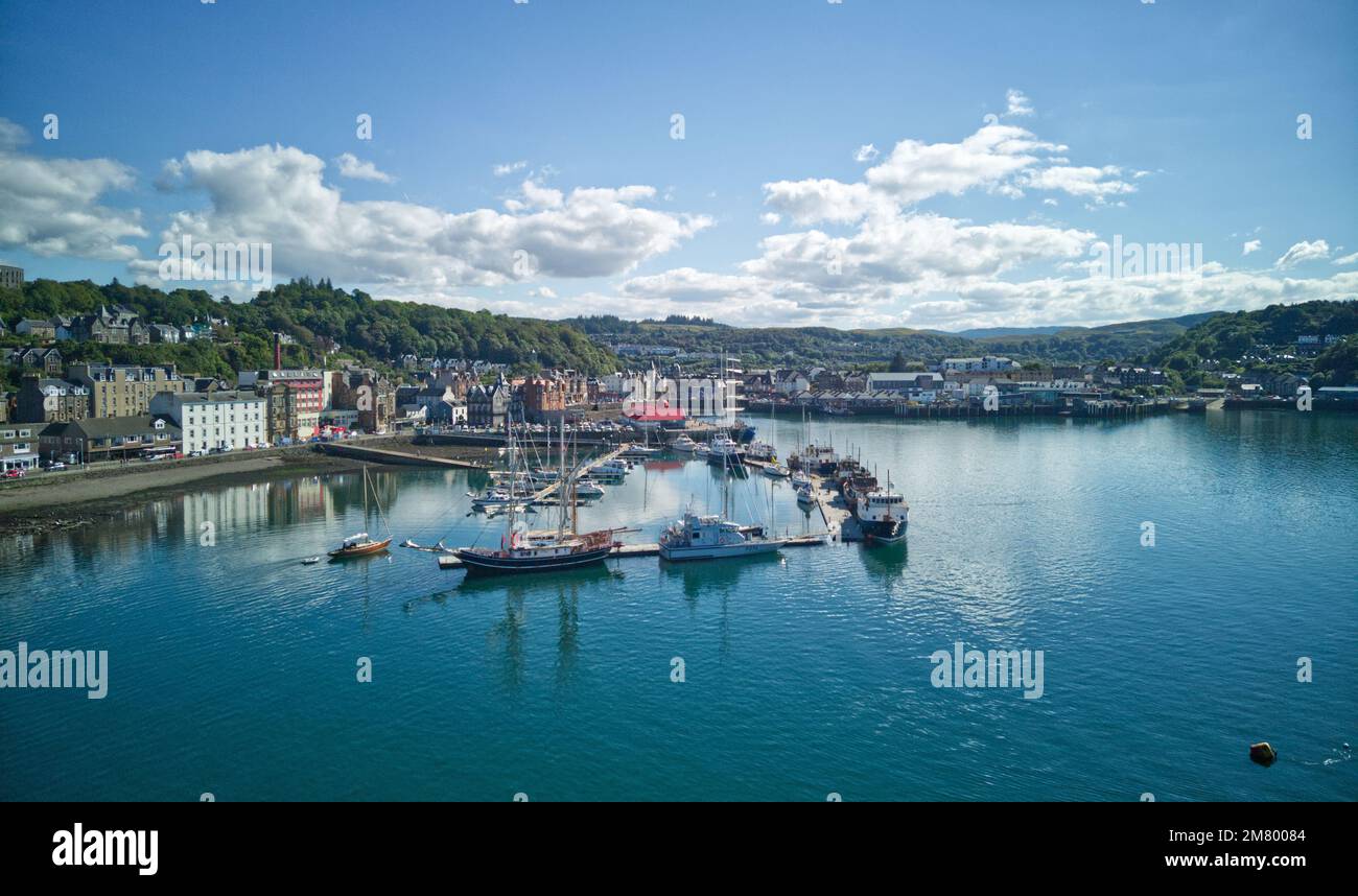 View of Oban Bay, Oban, Argyll Scotland with view of pontoons, McCaigs Tower and Oban town centre. Stock Photo
