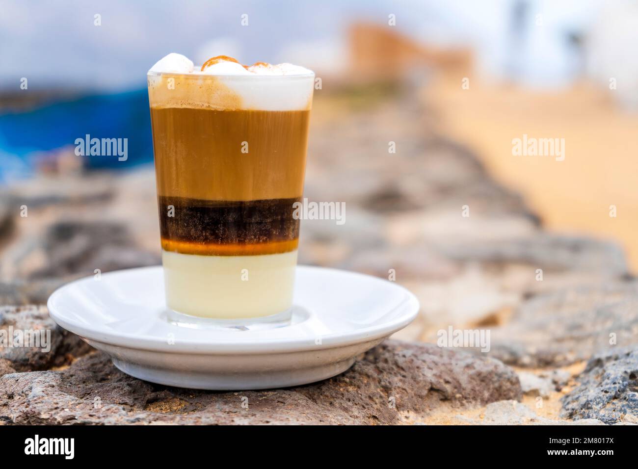 Delicious barraquito coffee with liquor and condensed milk, typical for