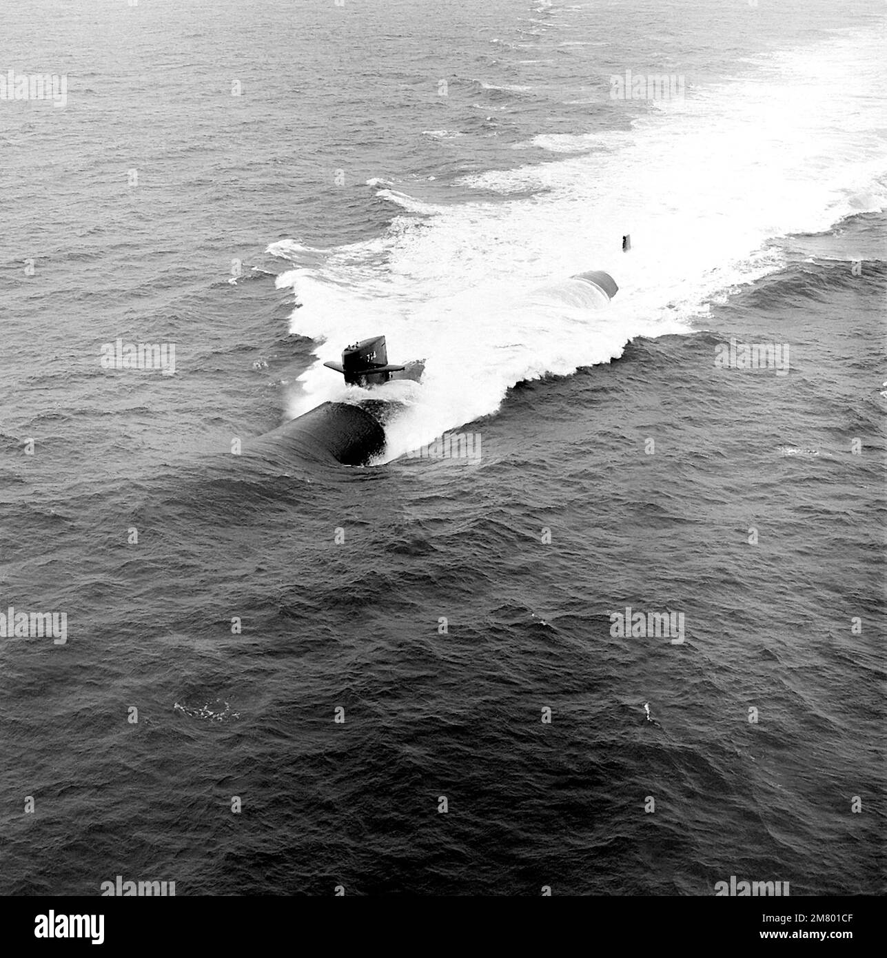 An aerial port bow view of the nuclear-powered attack submarine USS ...