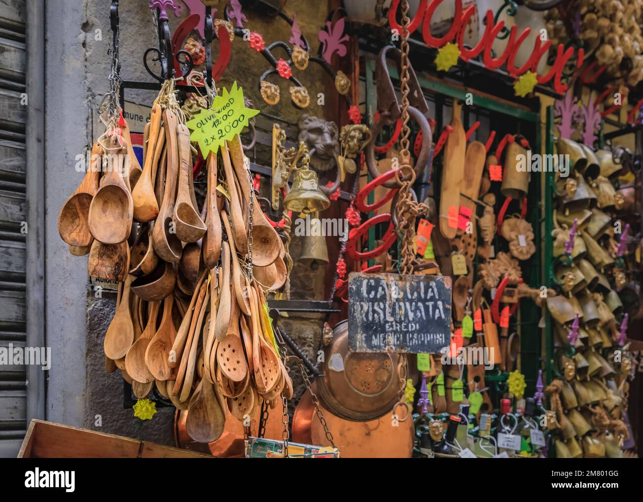 Various souvenirs on display at a gift shop in Centro Storico, kitchenware and utensils, food and cooking items in Florence, Italy Stock Photo