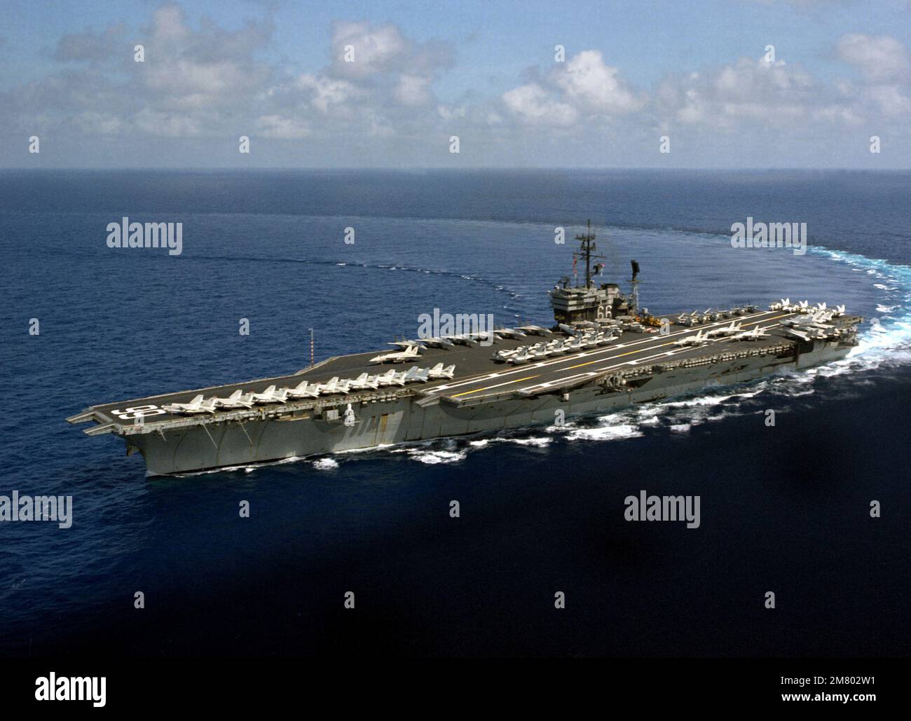 An aerial port bow view of the aircraft carrier USS AMERICA (CV-66 ...