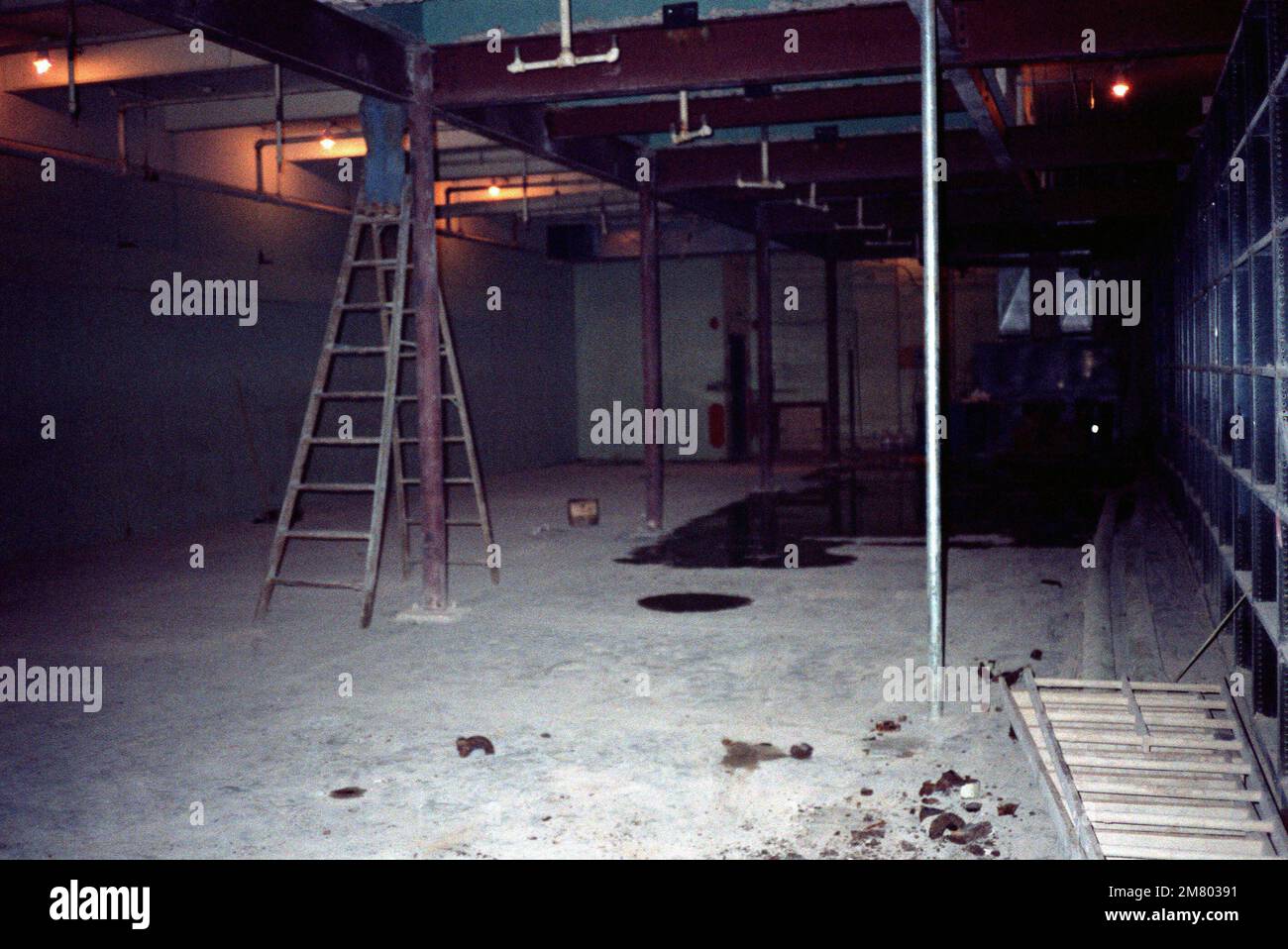 A workman is hardly visible atop his ladder, as work becomes nearly ...