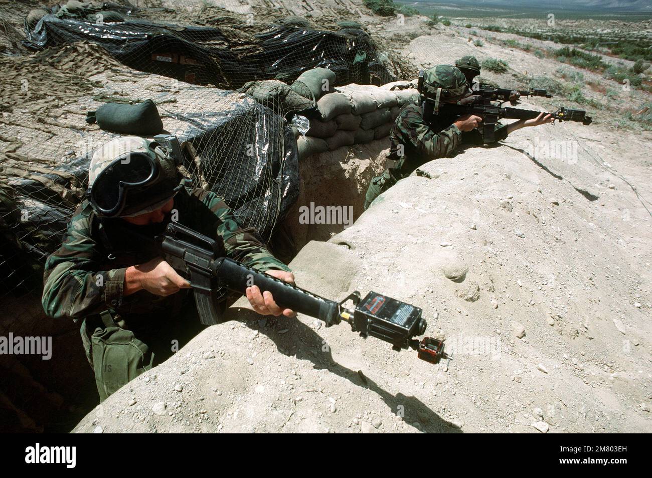 Airmen aim M16A1 rifles equipped with the multiple integrated laser engagement system (MILES) during Exercise CROWN DEFENDER. Subject Operation/Series: CROWN DEFENDER Base: Fort Irwin State: California (CA) Country: United States Of America (USA) Stock Photo