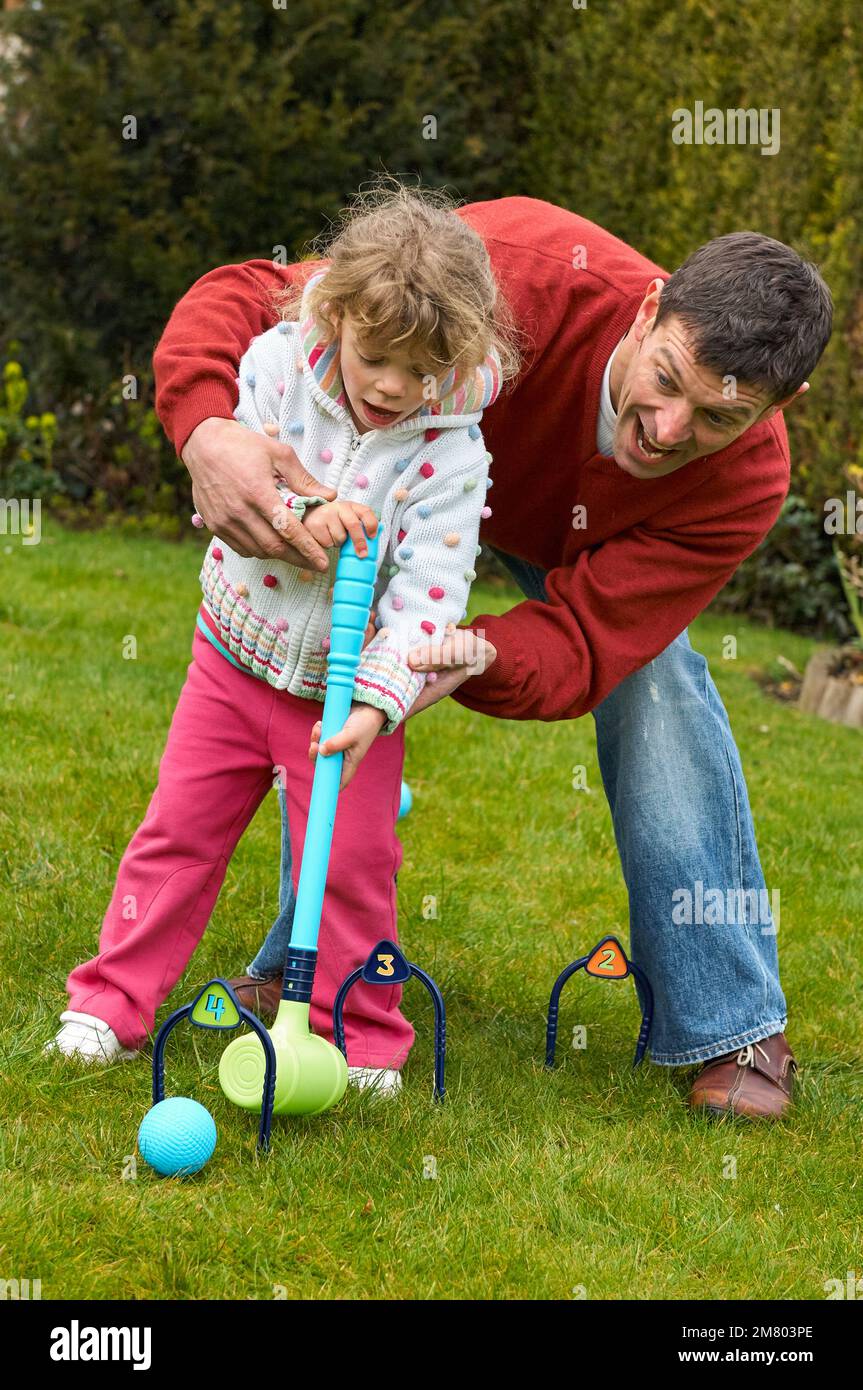 Learning croquet in an english garden hires stock photography and