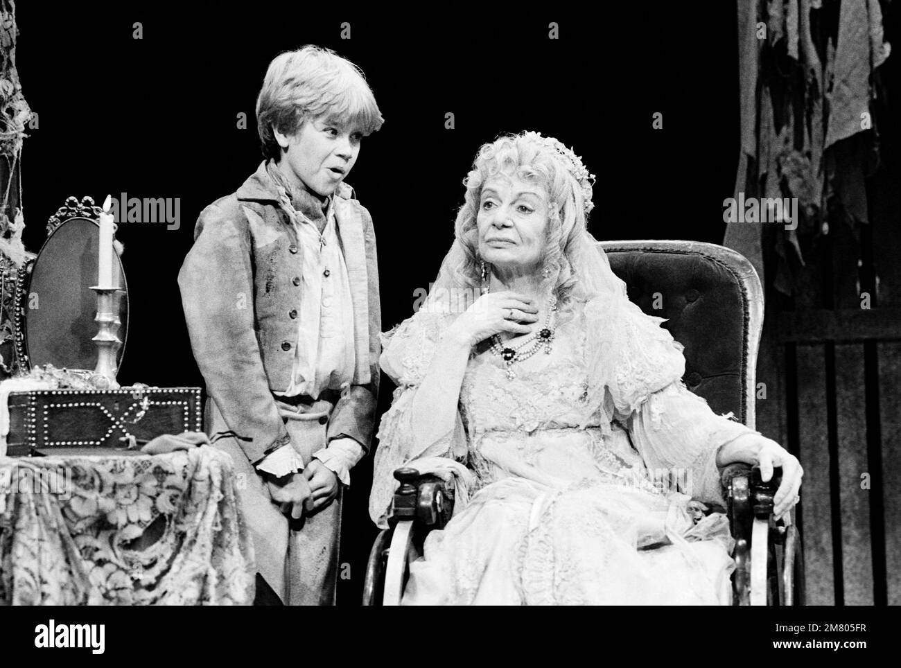 Anthony Pearson (Young Pip), Sheila Burrell (Miss Havisham) in GREAT EXPECTATIONS by Charles Dickens at The Old Vic, London SE1  02/01/1985  adapted & directed by Peter Coe  design: Peter Rice  lighting: Mark Henderson Stock Photo