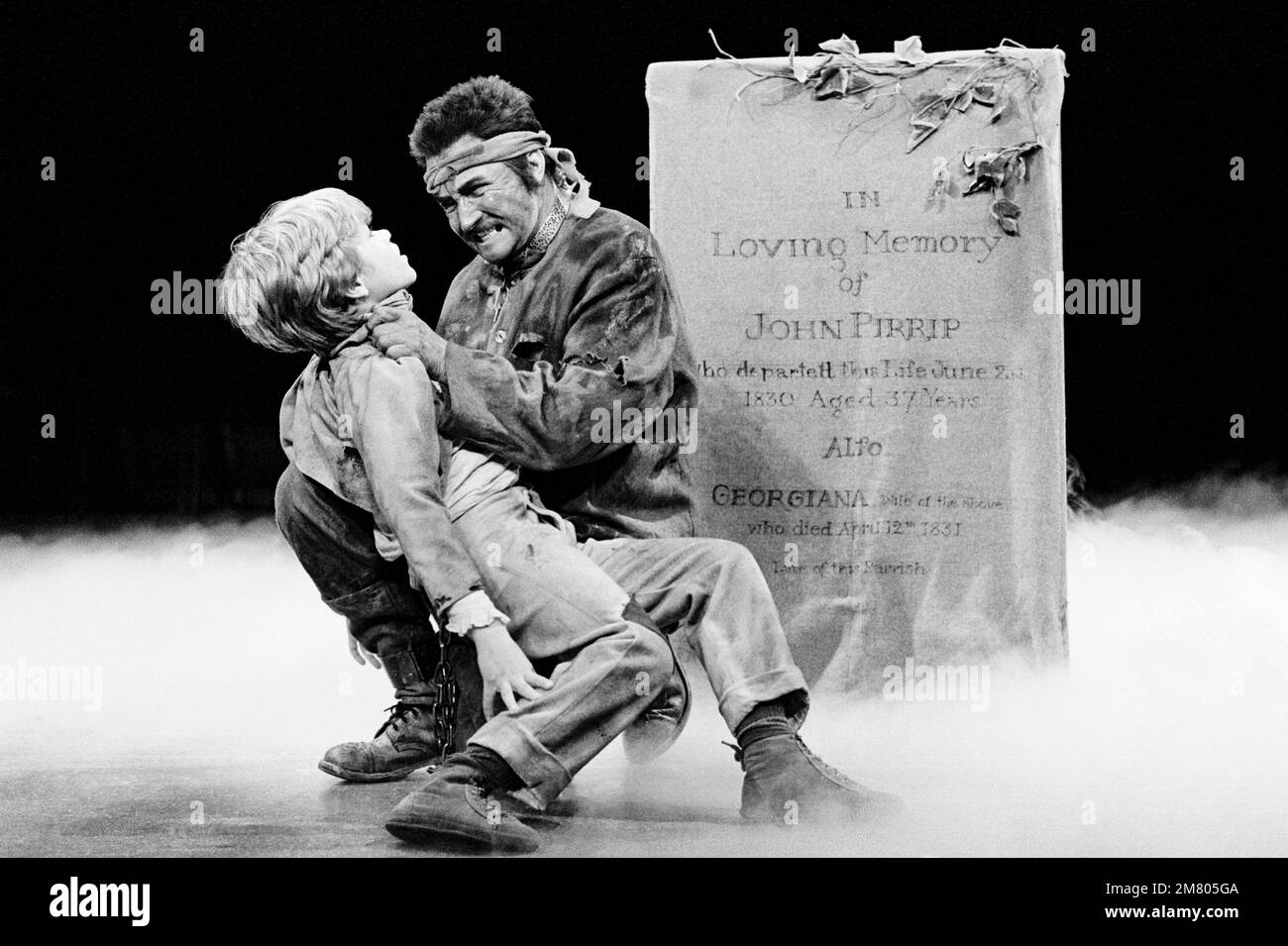 l-r: Anthony Pearson (Young Pip), Roy Dotrice (Magwitch) in GREAT EXPECTATIONS by Charles Dickens at The Old Vic, London SE1  02/01/1985   adapted & directed by Peter Coe  design: Peter Rice  lighting: Mark Henderson Stock Photo