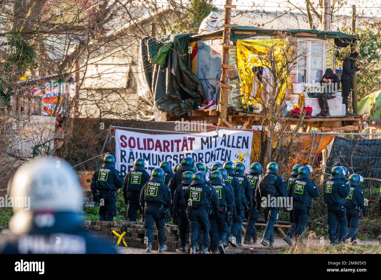 Activists have barricaded themselves in the German 'brown coal village' of Lutzerath in North Rhine-Westphalia. The activists have been occupying the village for more than two years to prevent it from being wiped off the face of the earth as agreed in a deal struck by the political. The energy company RWE mines lignite there, which activists blame for global warming and CO2 pollution. In the early morning, the police began to evacuate the village. Stock Photo