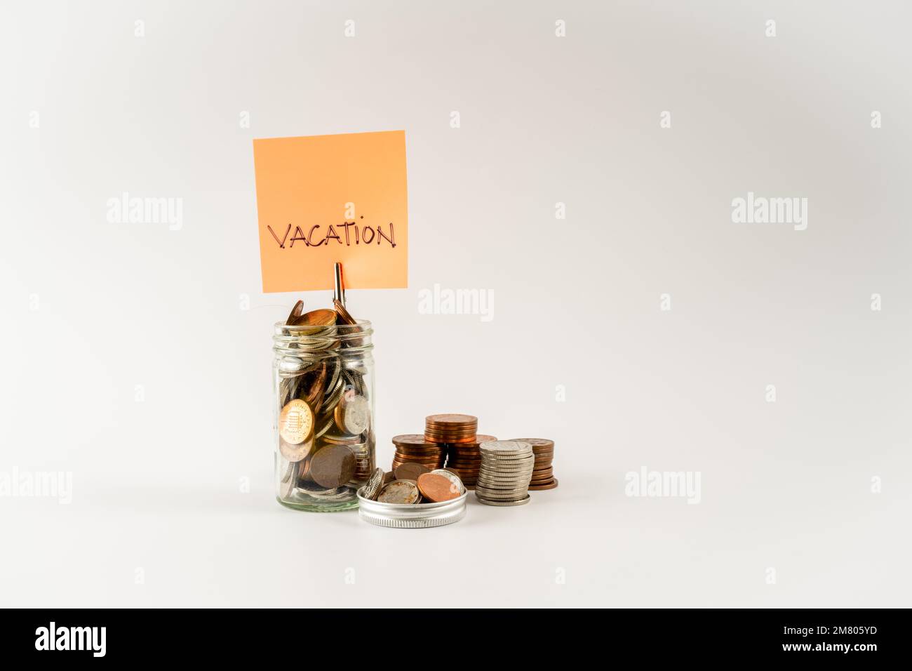 Vacation savings budget fund jar concept isolated on a white background Stock Photo