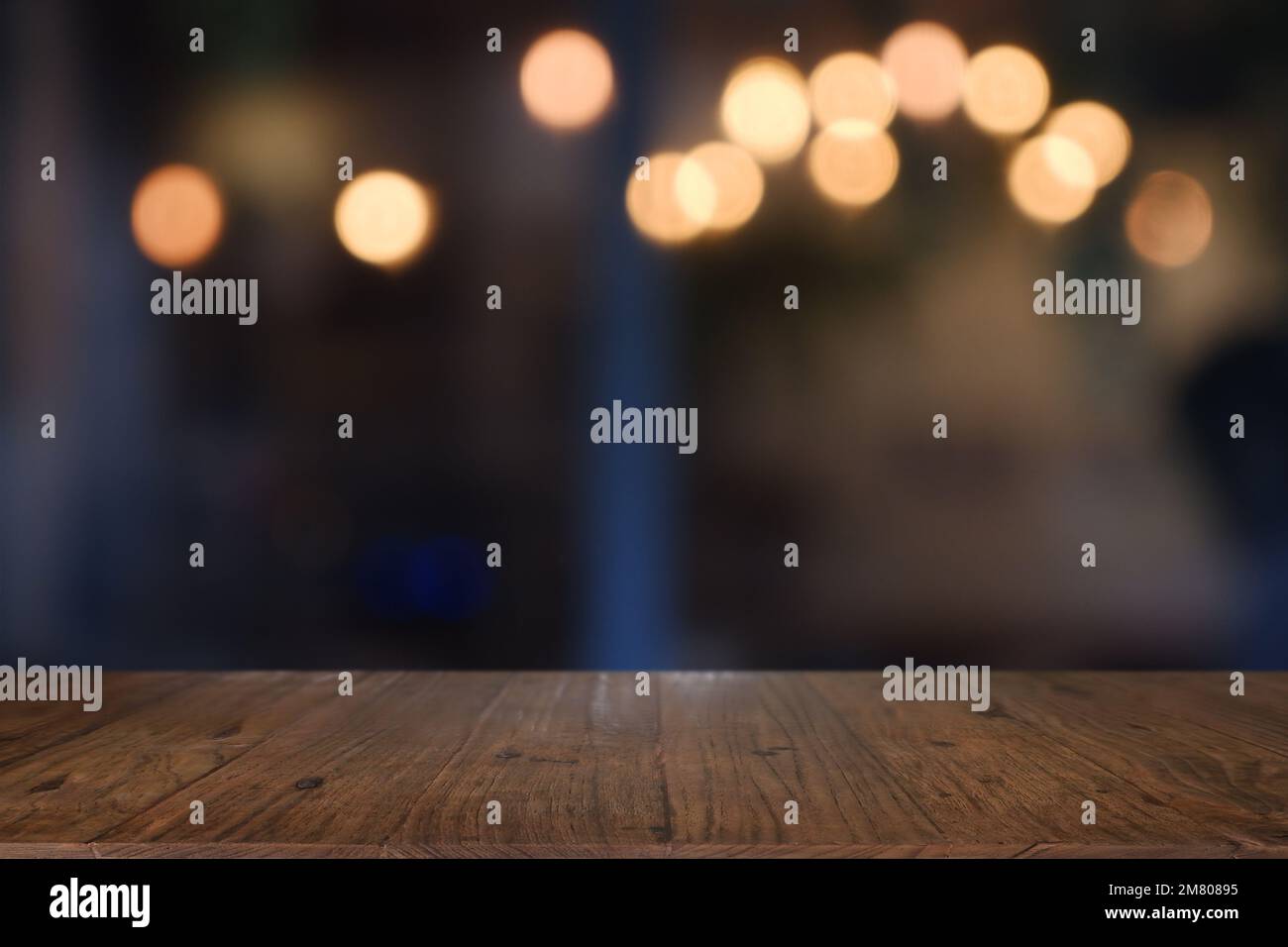 Empty wooden table in front of abstract blurred Cafe, restaurant at ...