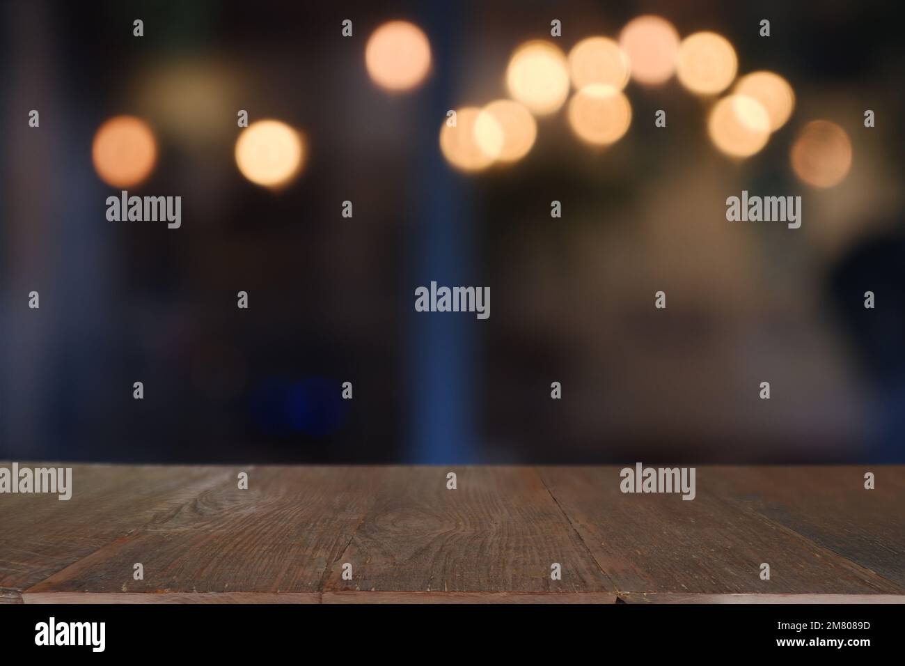 Empty wooden table in front of abstract blurred Cafe, restaurant at ...