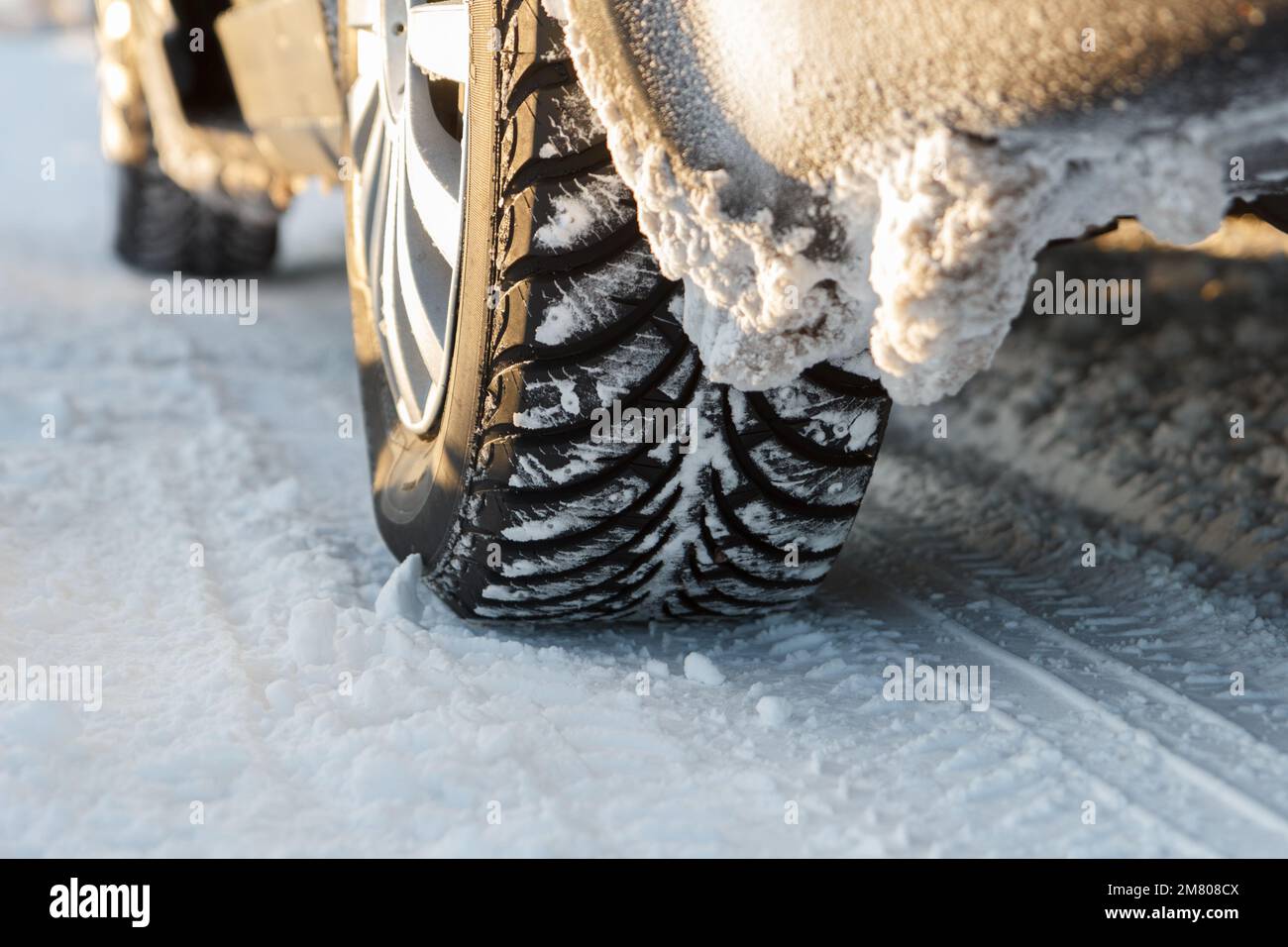 car winter tires on a snowy road Stock Photo Alamy
