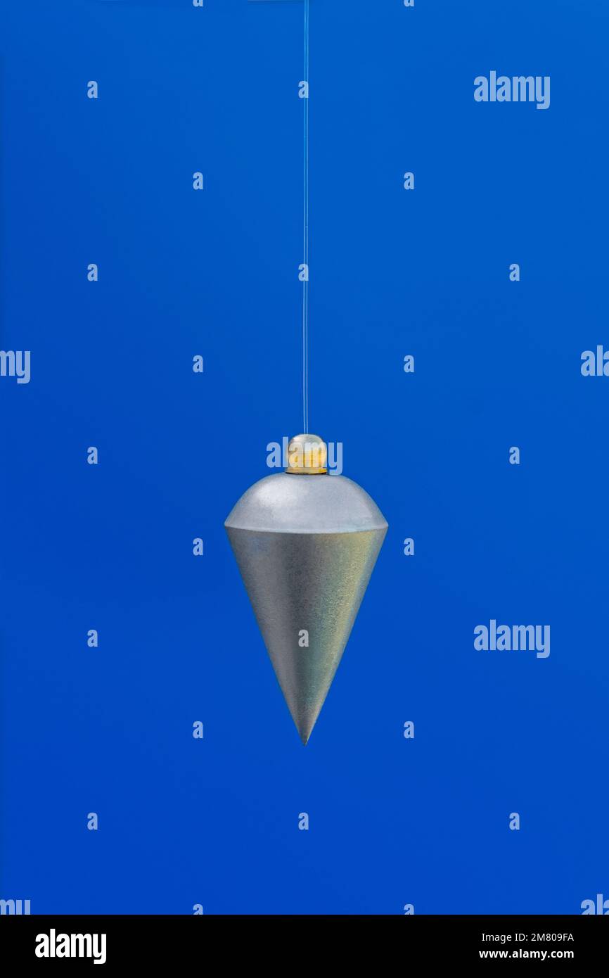 Silver pendulum hanging vertically and static Stock Photo Alamy