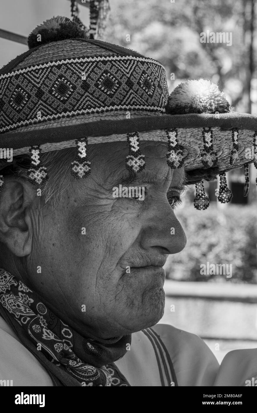 old man of the huichol wixarika culture with his traditional hat, selling his handicraft in mexico Stock Photo