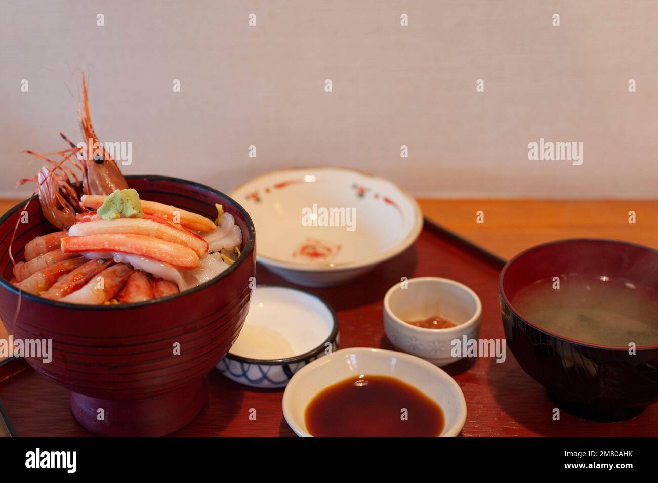 Fresh shrimp sashimi and crab meat top a seafood rice bowl, Wajima