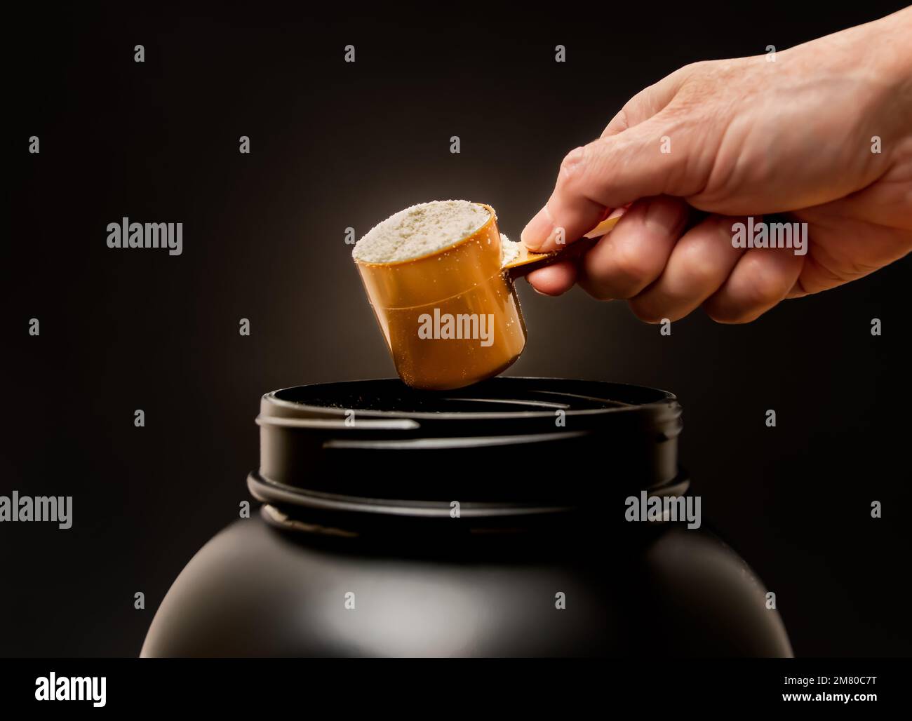 Scoop of whey protein powder. Ingredient for diet and fitness protein shake. Stock Photo