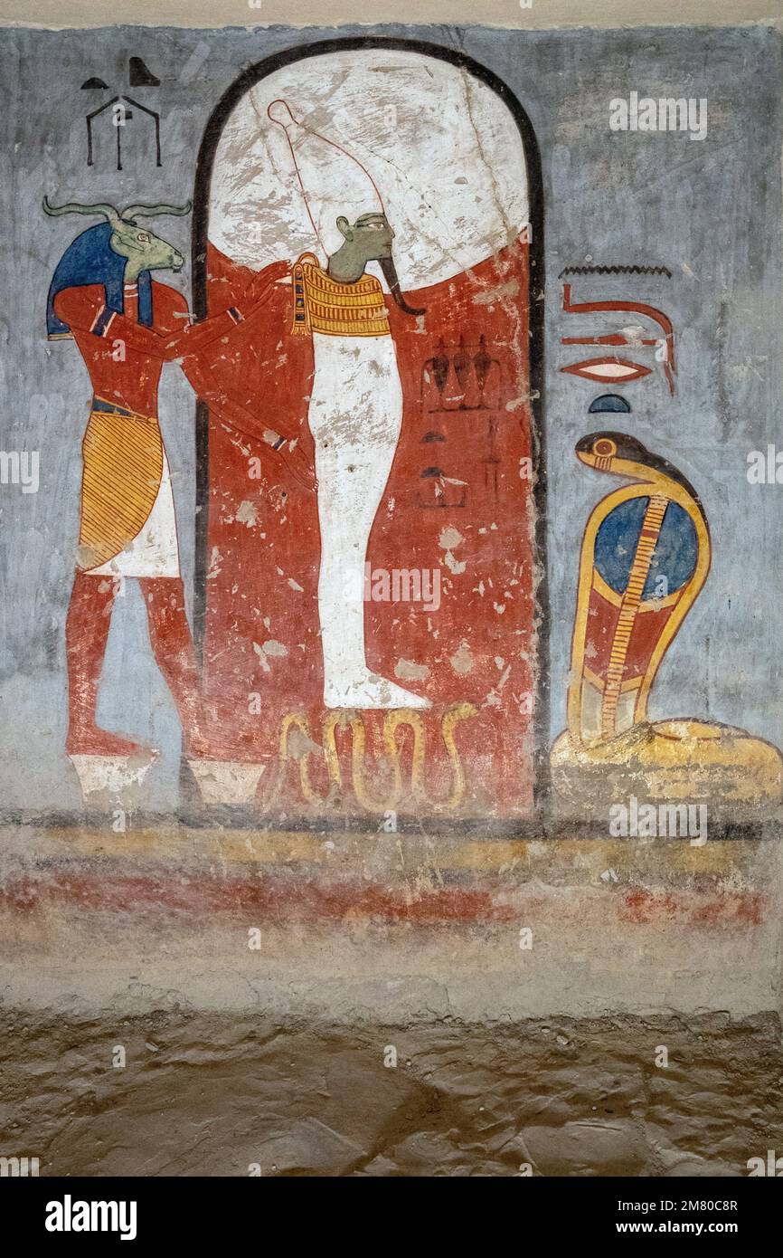 OSIRIS WITH ANUBIS (FUNERARY GOD WITH THE HEAD OF A WILD DOG) AND HORUS (GOD WITH THE HEAD OF A FALCON), BAS-RELIEF AND FRESCOES PAINTED IN BRIGHT COLORS, TOMB OF RAMSES I, VALLEY OF THE KINGS, LUXOR, EGYPT, AFRICA Stock Photo