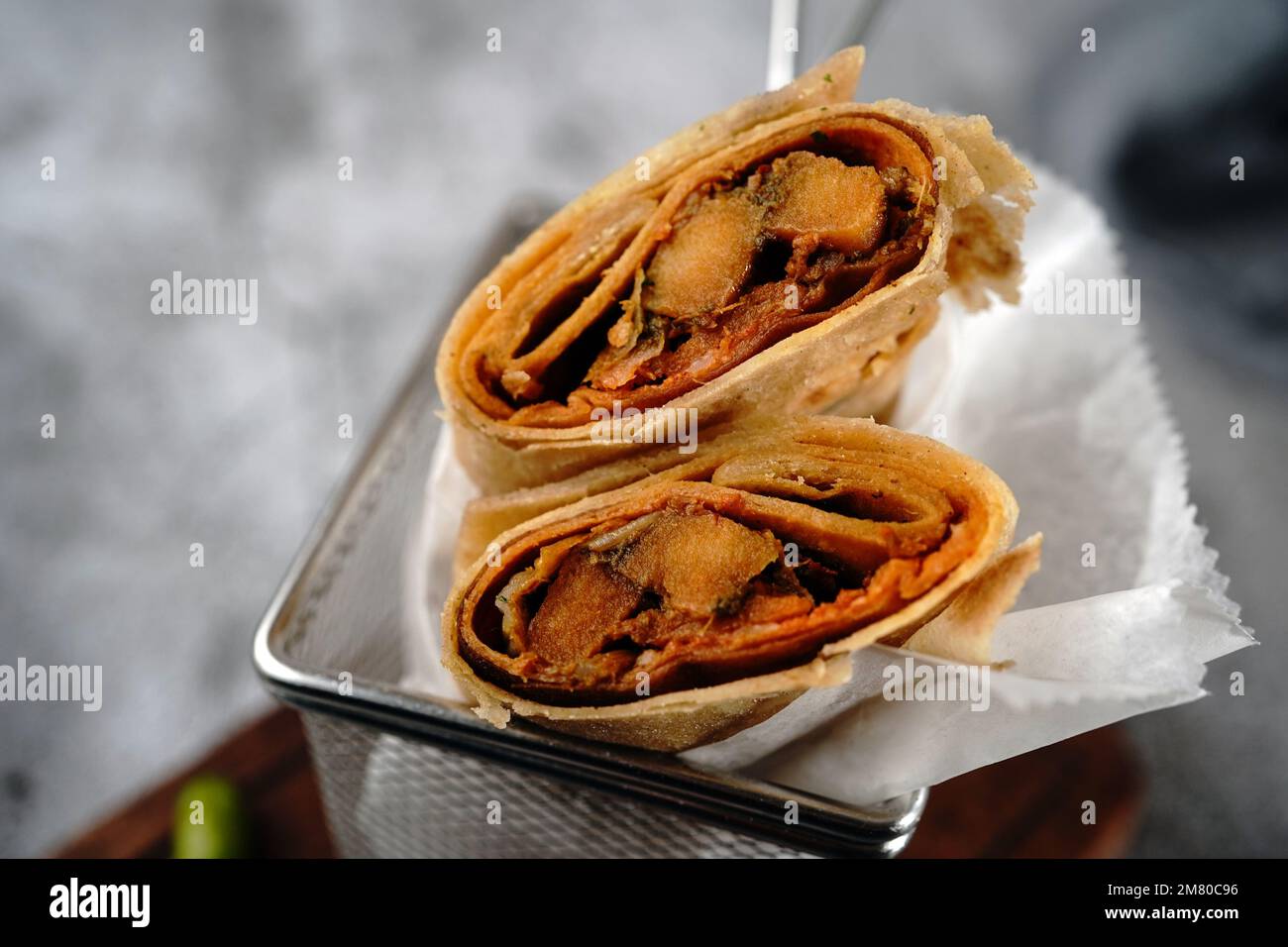 Potato Kathi roll Indian vegetarian wrap with roti, selective focus