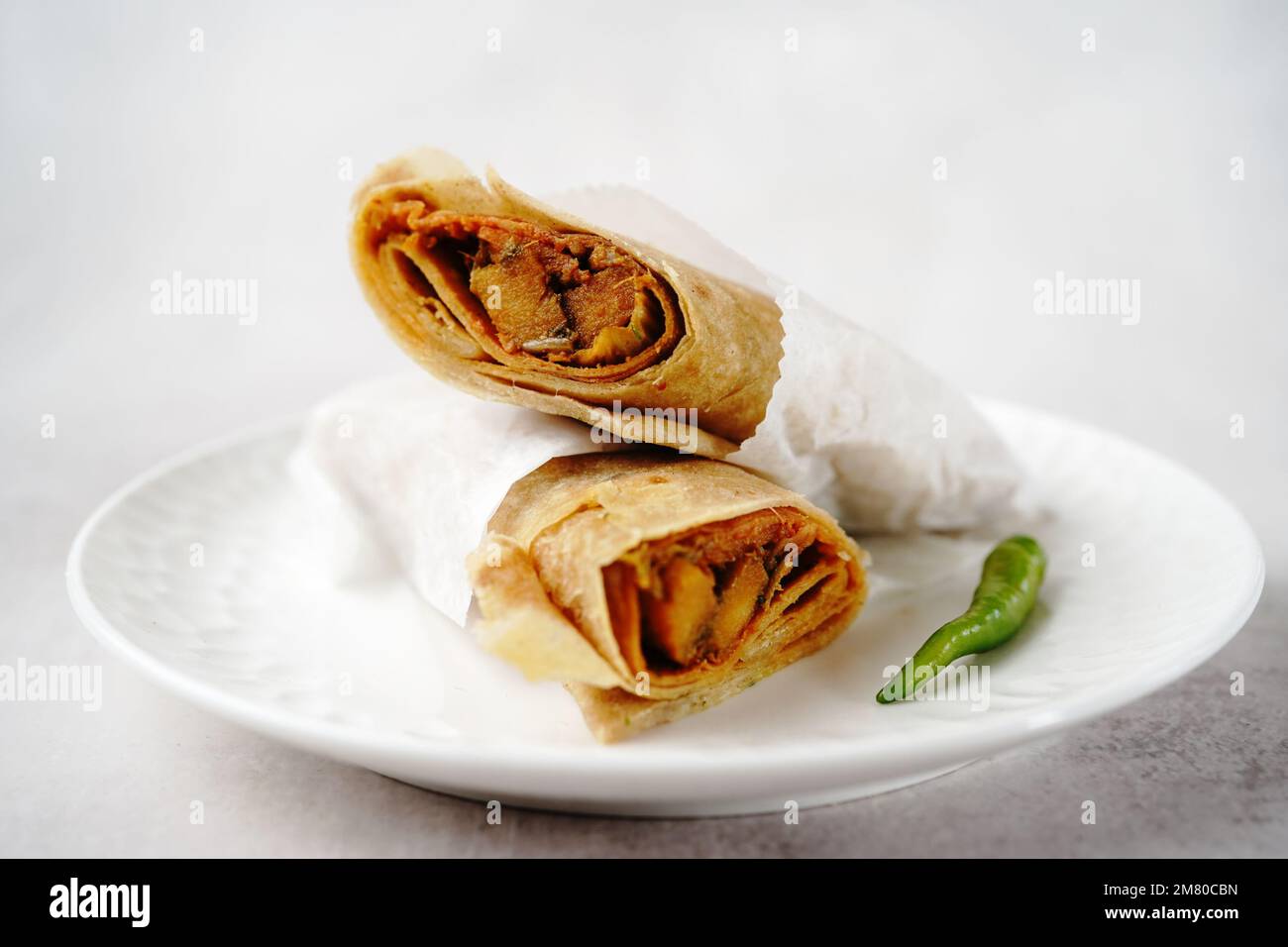 Potato Kathi roll Indian vegetarian wrap with roti, selective focus