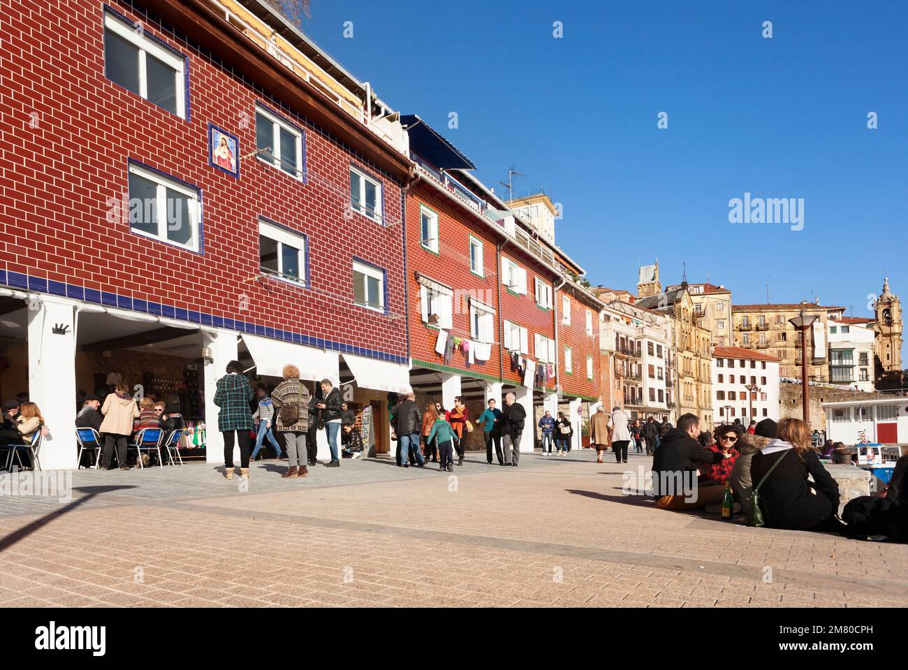 Donosti, Spain-December 21, 2014: People enjoy the sunny morning to take some tapas in the Donosti harbour Stock Photo