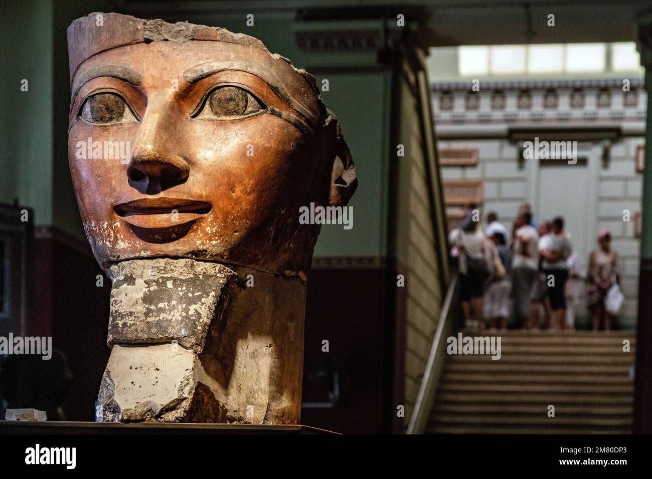 PAINTED LIMESTONE SCULPTURE OF THE HEAD OF QUEEN HATSHEPSUT OF THE 18TH