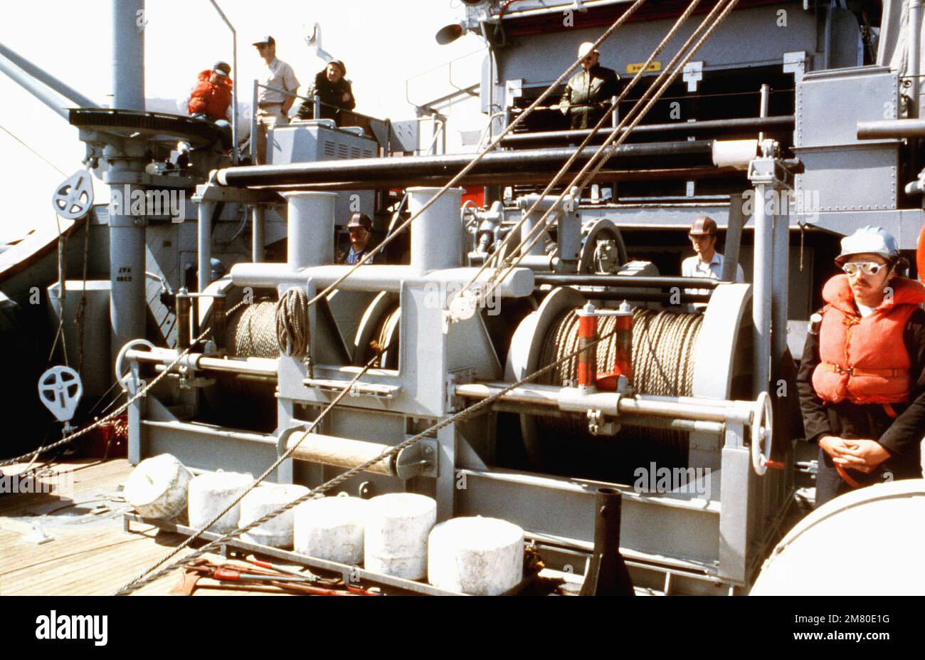 Winch operators wait for signals from the rig captain during sweeping