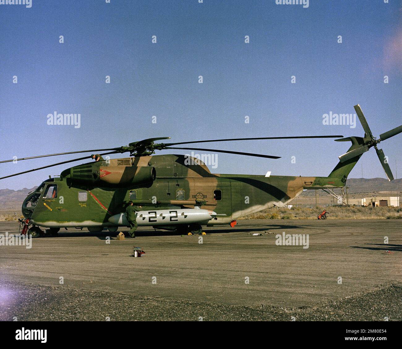 A left side view of an H-53 helicopter on the helipad at the Utah Test and Training Range. Base: Hill Air Force Base State: Utah (UT) Country: United States Of America (USA) Stock Photo