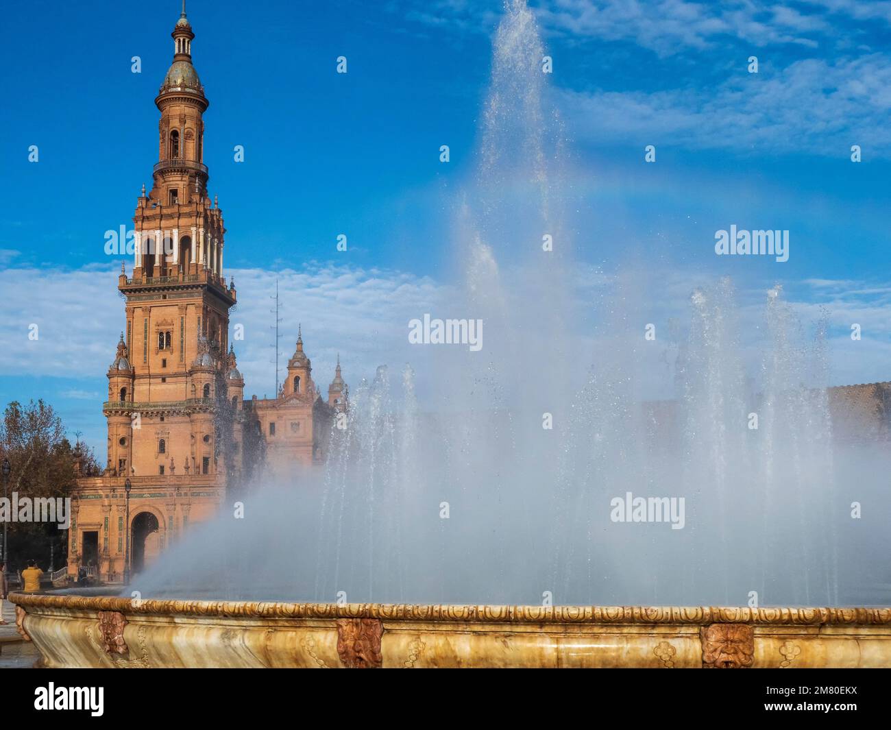 Water flows from the fountain in the Plaza de España in Seville. Stock Photo