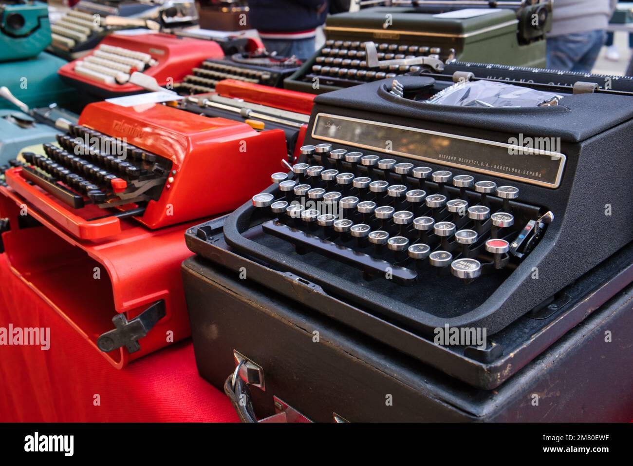 Collection of old colorful typewriters at the flea market in Cagliari Stock Photo