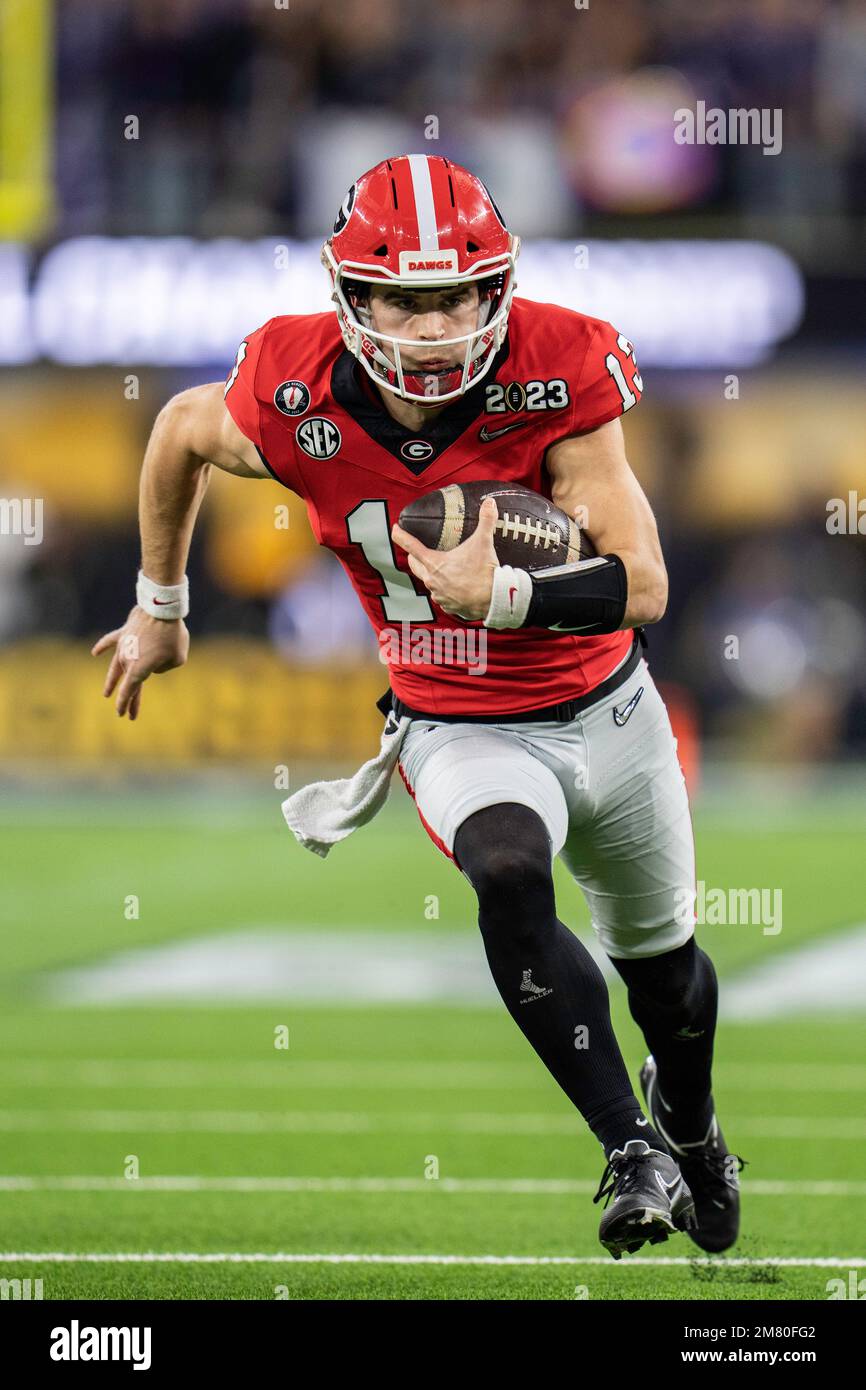 Bulldogs quarterback Stetson (13) runs the ball for a
