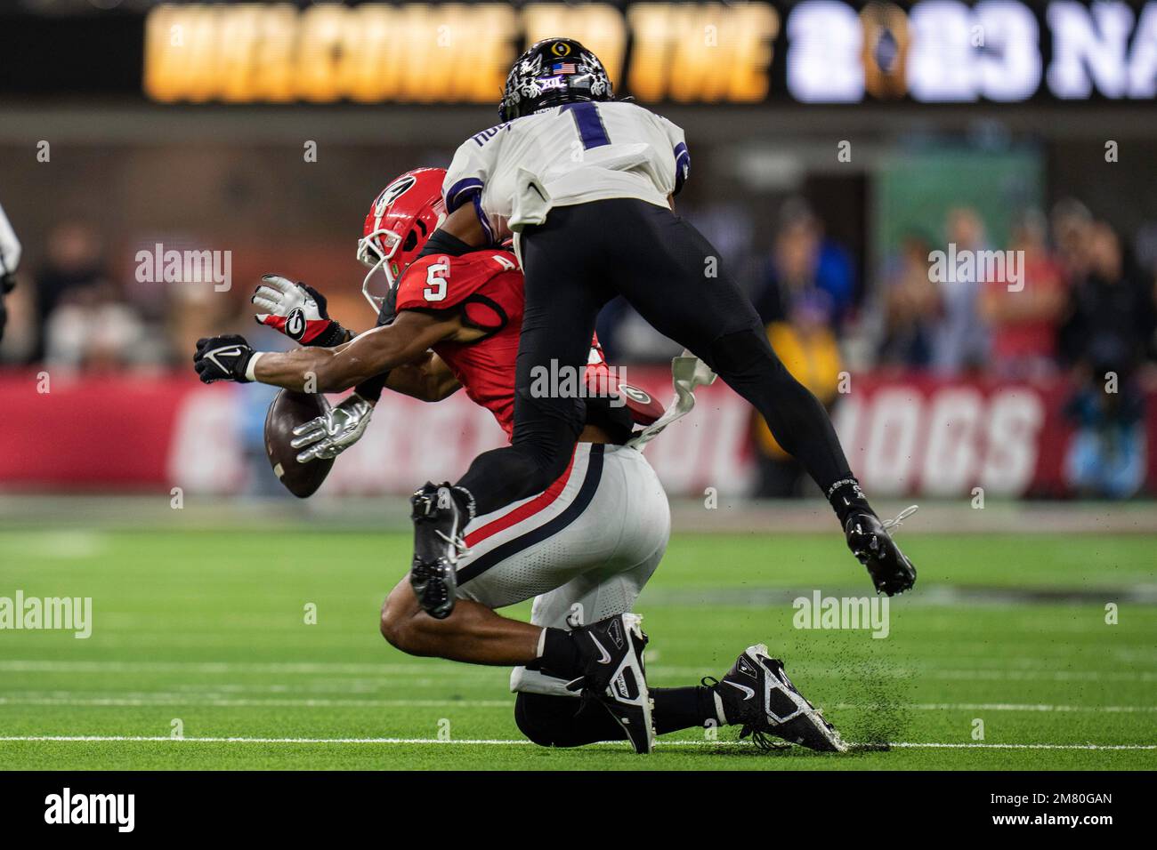 TCU Horned Frogs cornerback Tre'Vius Hodges-Tomlinson (1) is called for pass interference against Georgia Bulldogs wide receiver Adonai Mitchell (5) d Stock Photo