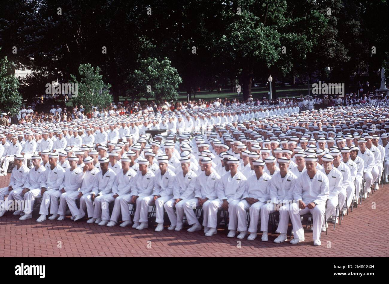 Midshipmen of the class of 1987 sit in the courtyard of Tecumseh Court during their swearingin