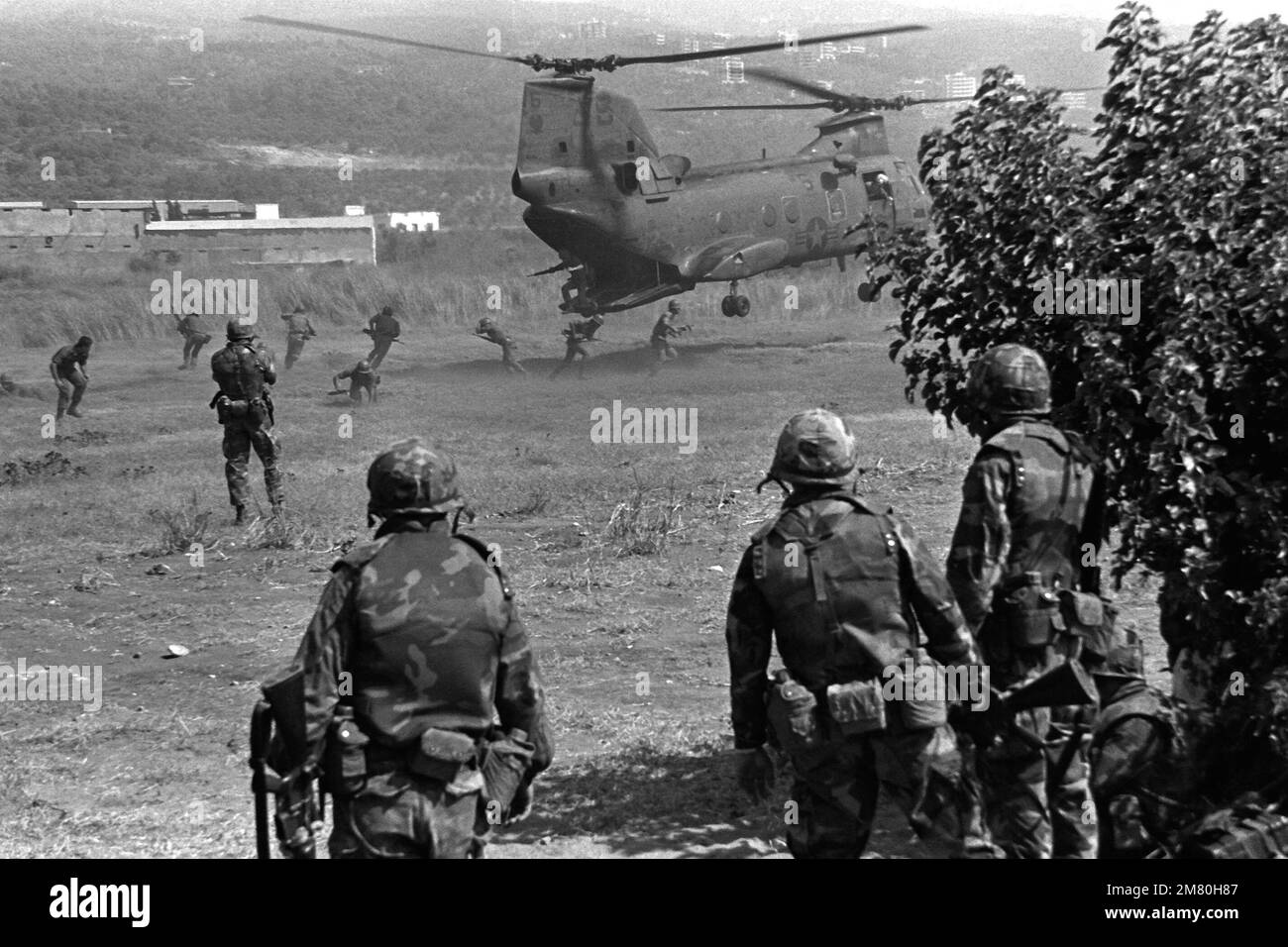 Marines move toward a landing CH-47 Chinook helicopter during their participation as members of a multinational peacekeeping force. Base: Beirut Country: Lebanon (LBN) Stock Photo