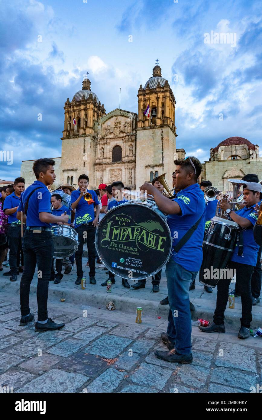 A band plays on the street in front of the Church of Santo Domingo de Guzman in Oaxaca, Mexico. Stock Photo