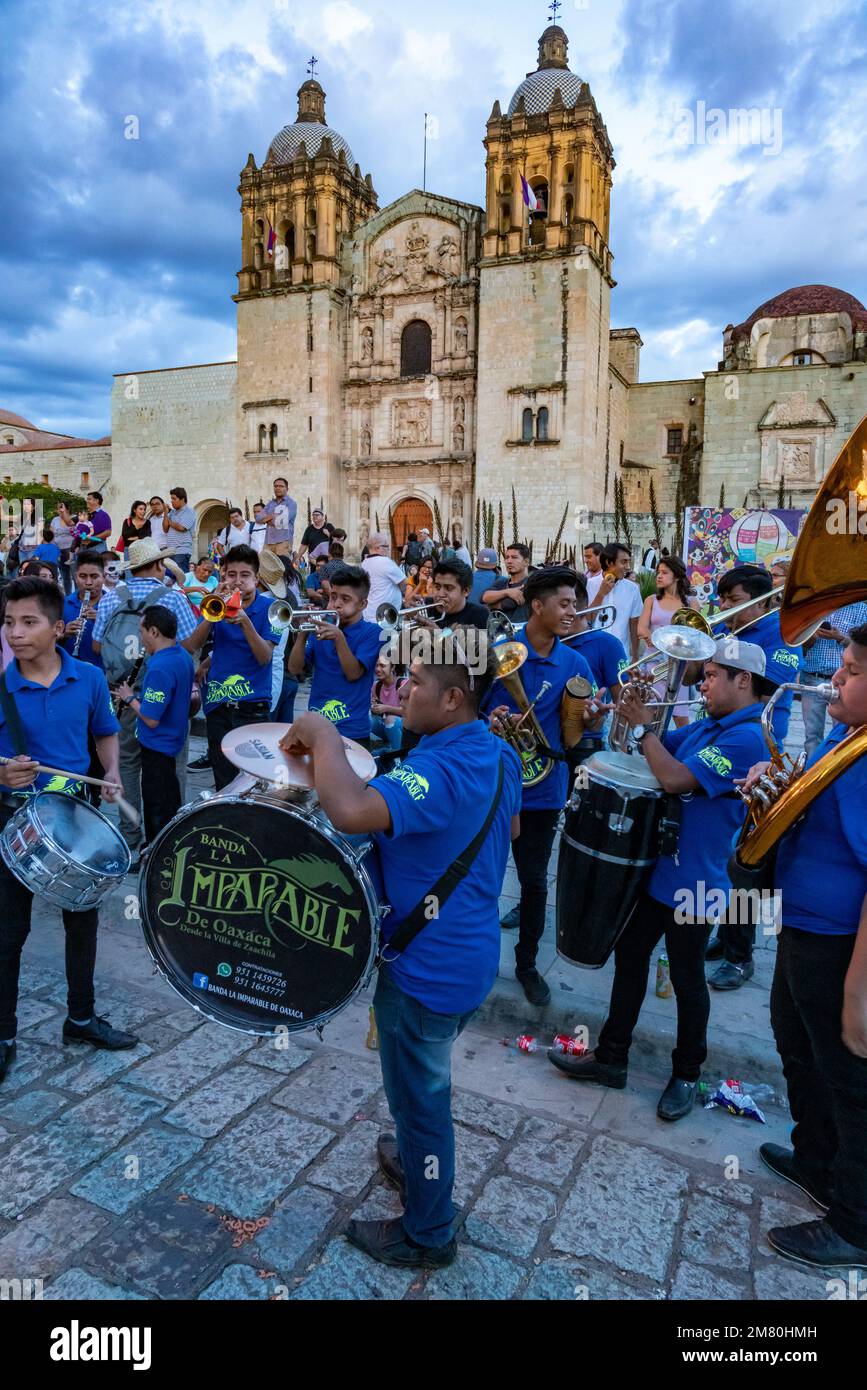 A band plays on the street in front of the Church of Santo Domingo de Guzman in Oaxaca, Mexico. Stock Photo