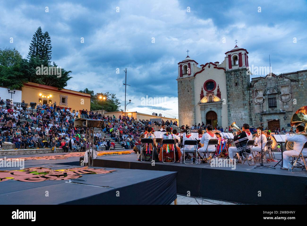 A school orchestra plays a concert on the Plaza de Danza in front of the ex-convent of San Jose in the historic Oaxaca, Mexico. Stock Photo