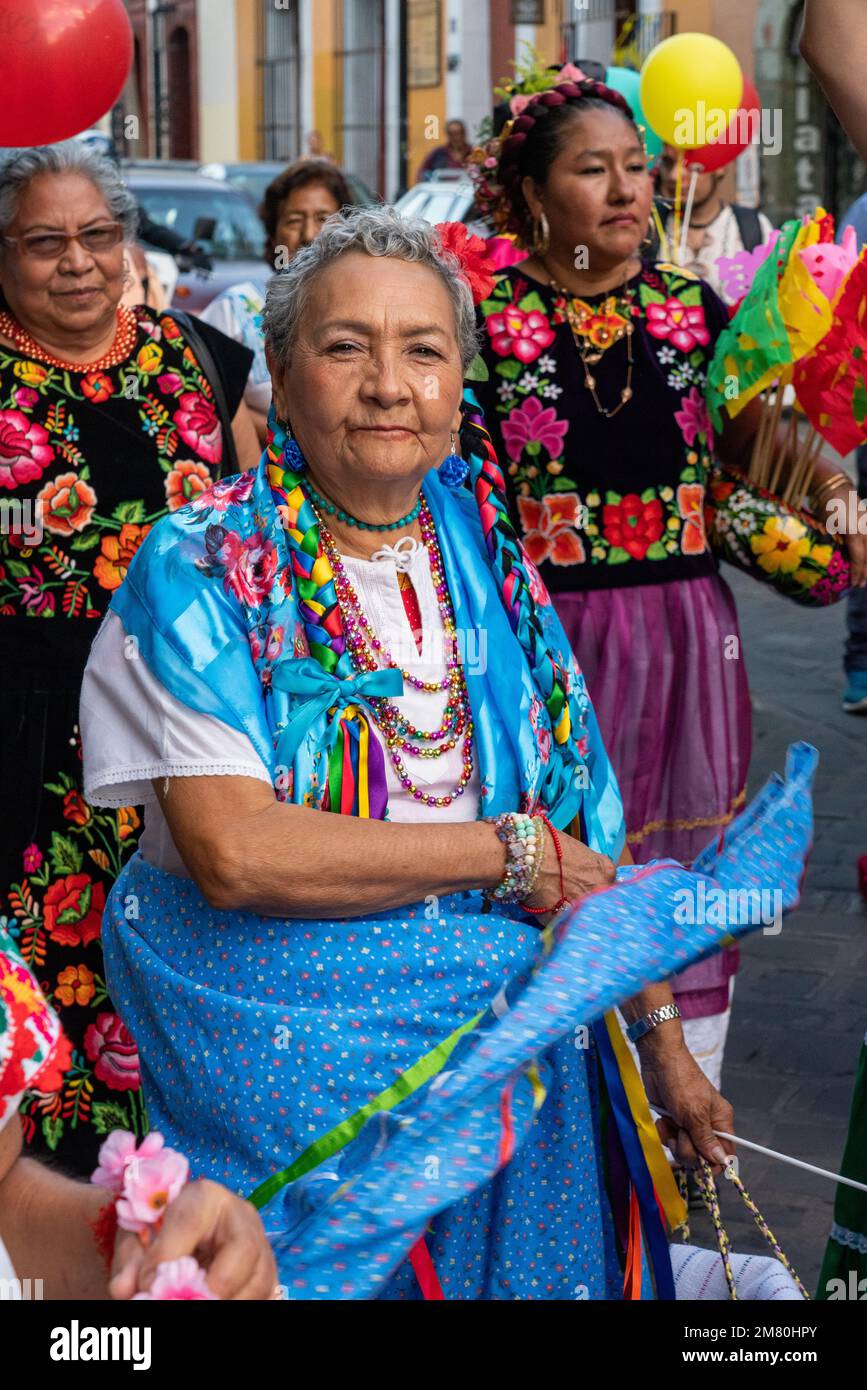 Older women in traditional dress gather for a parade on the streets of Oaxaca, Mexico. Stock Photo