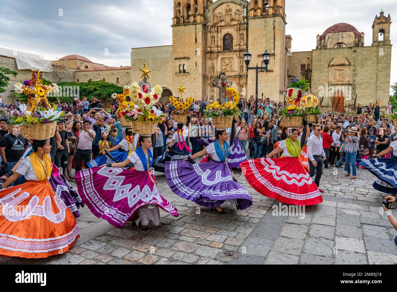 Chinas Oaxaquenas dancers perform in front of the Church of Santo Domingo at the Guelaguetza festival in Oaxaca, Mexico. Stock Photo