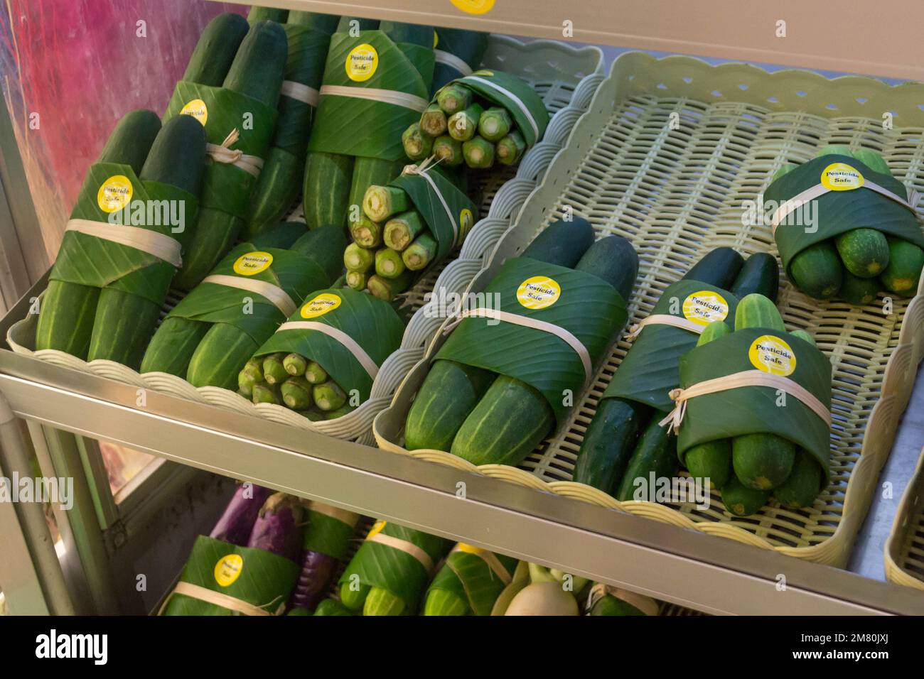 Plastic free, pesticide safe cucumbers, okra and eggplants. Stock Photo