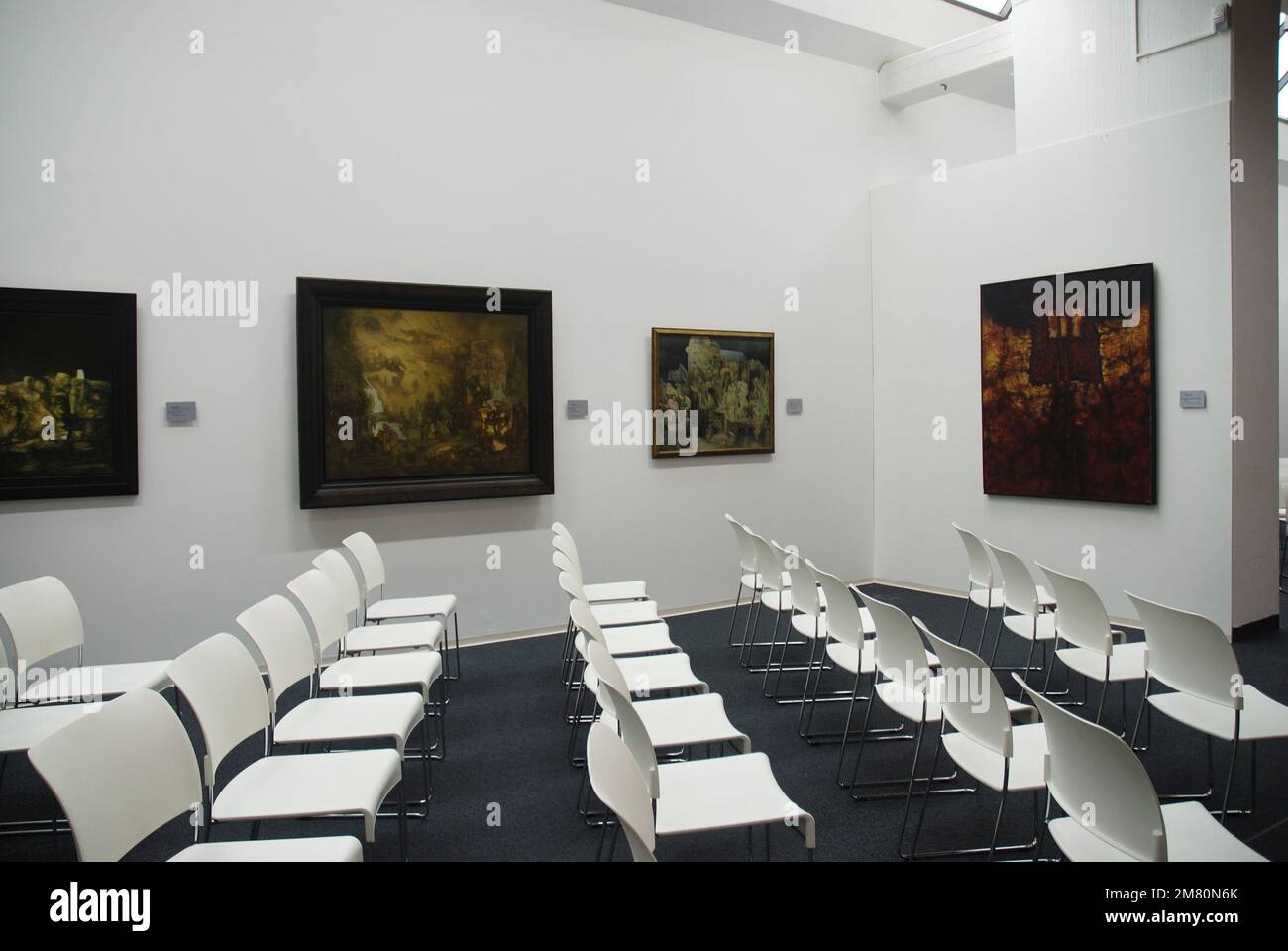 empty chairs at an art exhibition in a museum Stock Photo