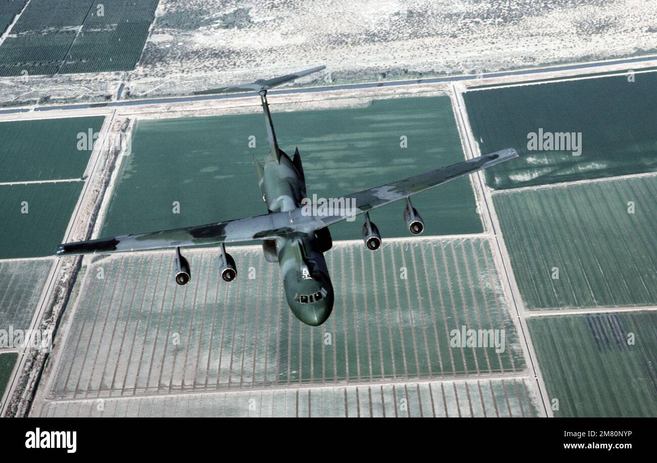 An air-to-air overhead front view of a C-141B Starlifter aircraft, with ...