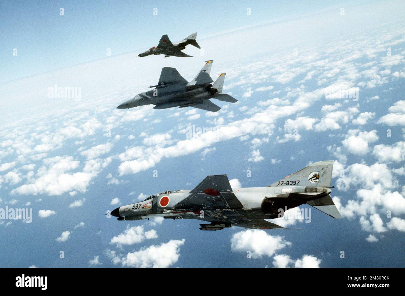 An air-to-air left side view of two Japanese Air Self Defense Force ...