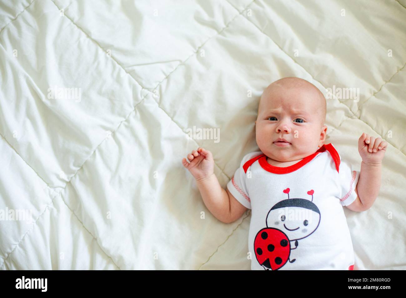 The little baby sleeps folding its legs one on top of the other. Small